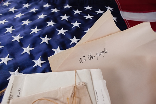 Close-up of legal documents arranged on American flag
