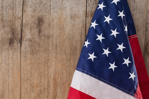 Close-up of an American flag on a wooden table