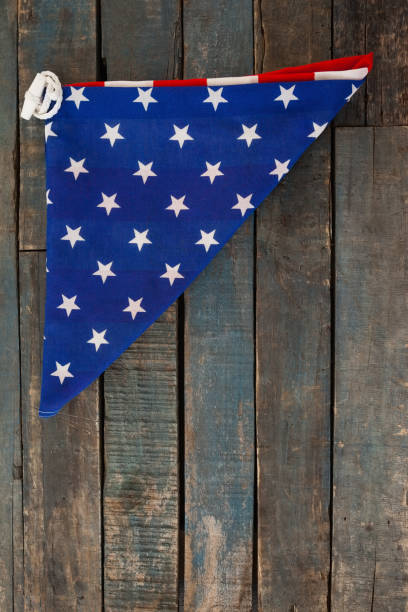 istock Folded American flag on wooden table 801049068