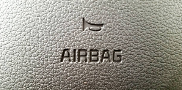 istock Airbag and Horn Symbol On Steering Wheel 801049378