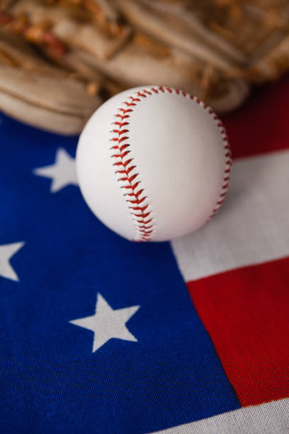 istock Baseball and gloves on an American flag 801054454