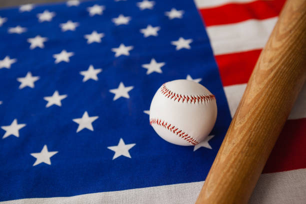 istock Baseball bat and ball on American flag 801054478