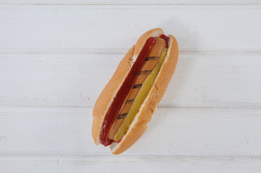 Close-up of hot dog on wooden table