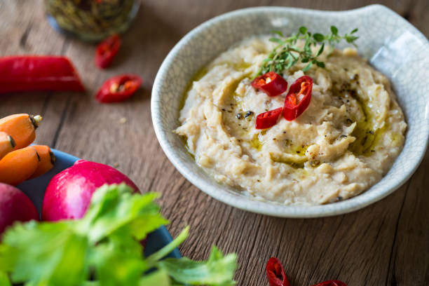 istock Cannellini beans dip with baby carrot,celery and radish 801059750