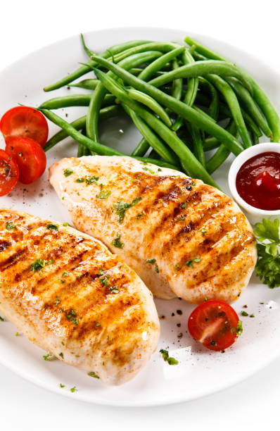 istock Grilled chicken fillet and vegetables 801072160