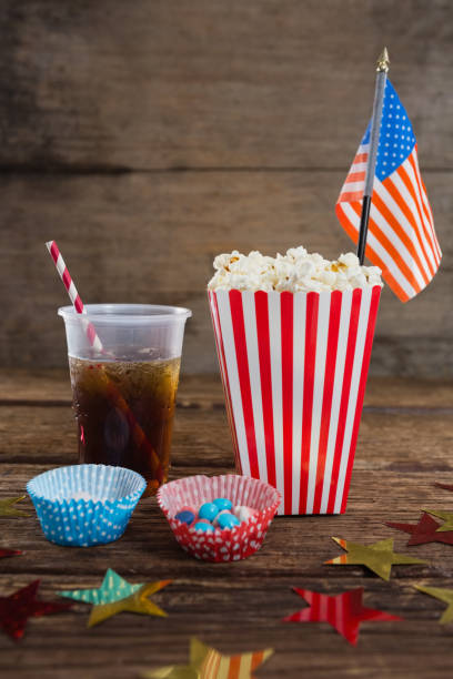 istock Popcorn, sweet food and cold drink decorated with 4th july theme 801077210