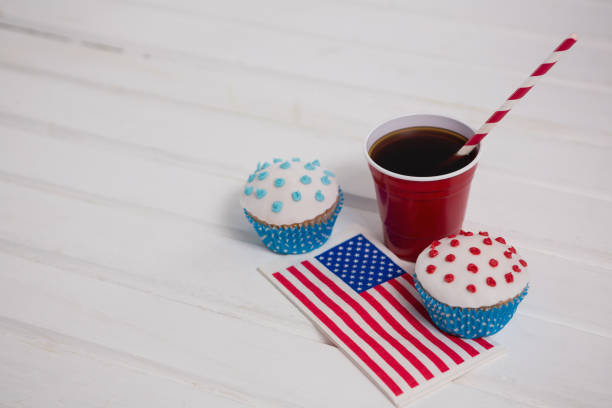 istock Decorated cupcakes and cold drink with 4th july theme 801087534