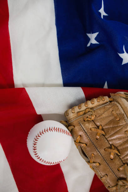 istock Baseball and gloves on an American flag 801089774