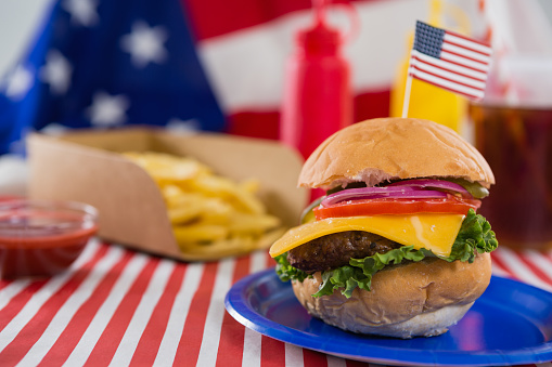 Close-up of burger decorated with 4th july theme