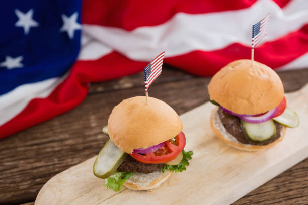 istock Burgers arranged on wooden board 801090082
