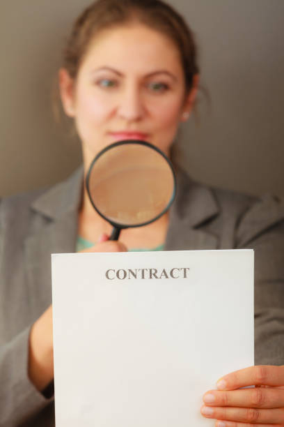 istock Business woman with contract and loupe 801090294