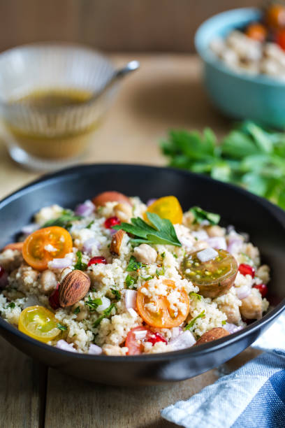 istock Couscous with Pomegranate and Almond salad by salad dressing 801090304