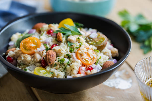 istock Couscous with Pomegranate and Almond salad by salad dressing 801090362