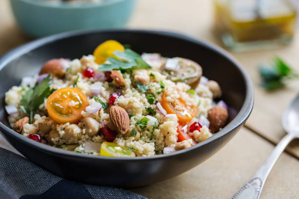istock Couscous with Pomegranate and Almond salad by salad dressing 801090370