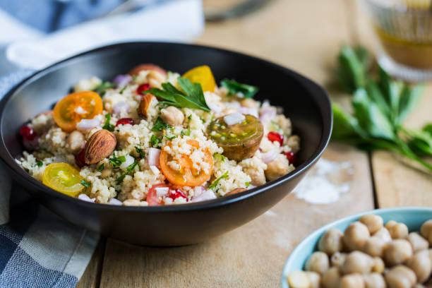 istock Couscous with Pomegranate and Almond salad by salad dressing 801090388