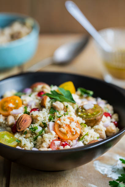 istock Couscous with Pomegranate and Almond salad by salad dressing 801090390