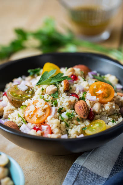 istock Couscous with Pomegranate and Almond salad by salad dressing 801090424