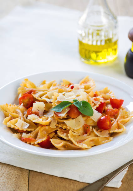 istock Farfalle in tomato sauce with grated parmesan 801092874