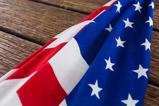 Close-up of an American flag on a wooden table