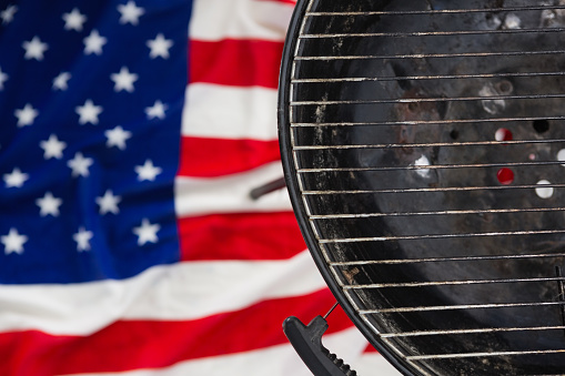 Close-up of barbeque against American flag
