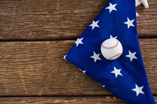 Close-up of baseball on an American flag