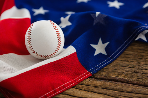 Close-up of baseball on an American flag