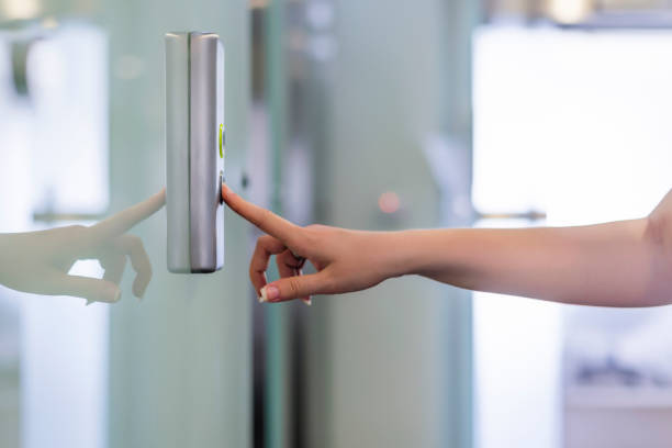 Heading up to the office Pushing button. Close-up of female hand pushing button of elevator during the day. hand elevator stock pictures, royalty-free photos & images