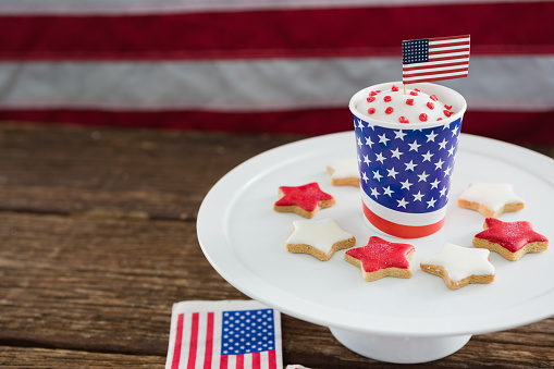 Close-up of patriotic coffee with American flag on wooden table