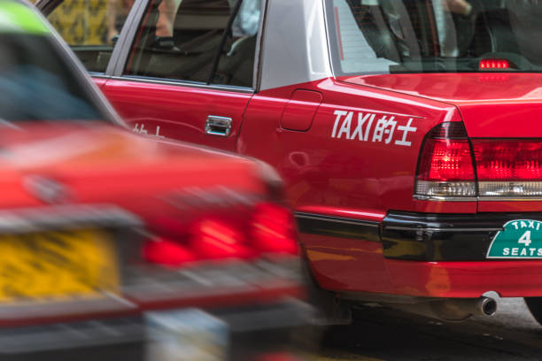 istock red taxi on street 801124622
