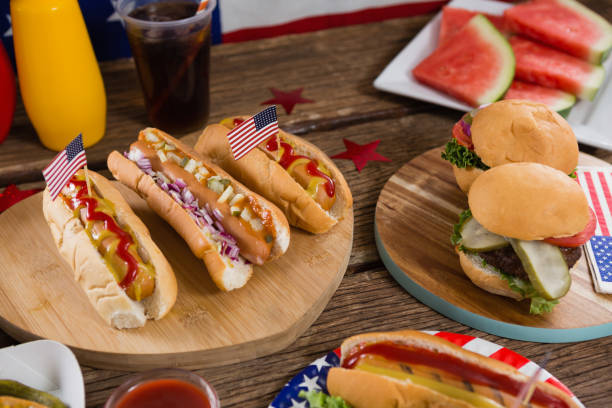 istock Hot dogs on wooden table with 4th july theme 801142280