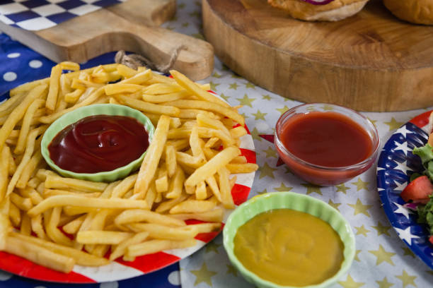 istock French fries on wooden table with 4th july theme 801142476