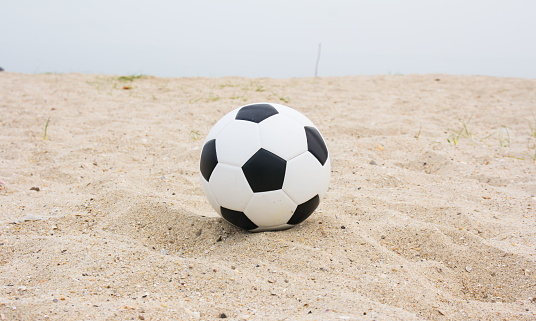 Soccer ball on beach