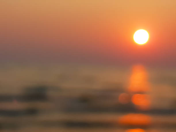 istock Blurry scence of sunset with the ocean's wave 801173148