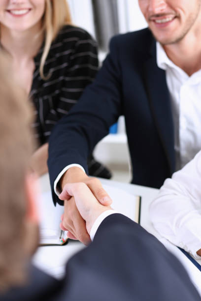 istock Group business peoples shake hands as hello in office closeup 801187608