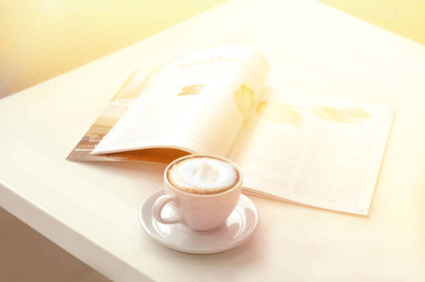 istock drink coffee and reading magazine 801192774