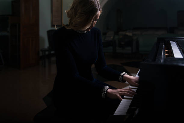 istock Girl Playing the Piano 801204332