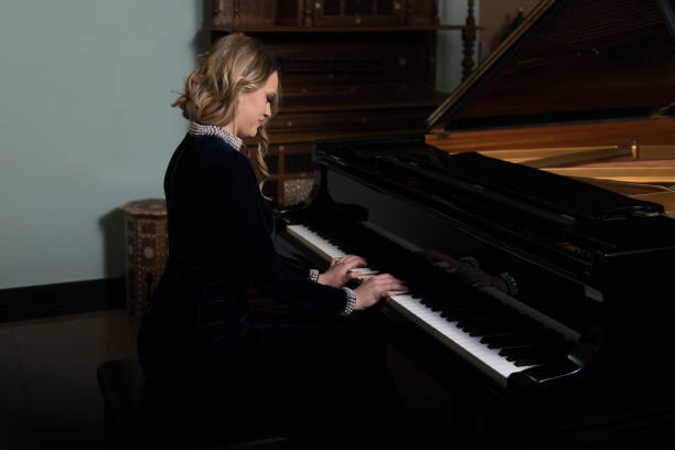 istock Girl and Piano 801204666