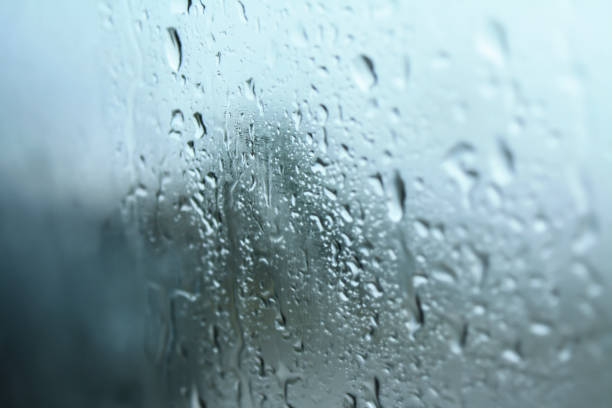 istock rain drops on car window, Droplets on glass 801206512