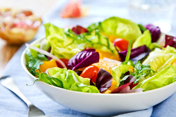 istock Orange with Rocket and Pomegranate salad in a bowl 801221822