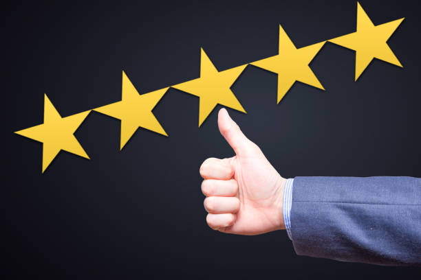 istock Review, rating, ranking, evaluation and classification concept. Businessman is satisfied with company 5 stars rating. Isolated on black 801239522