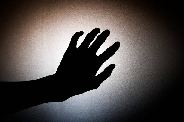 istock hand shadows with Frosted glass - concept 801242016