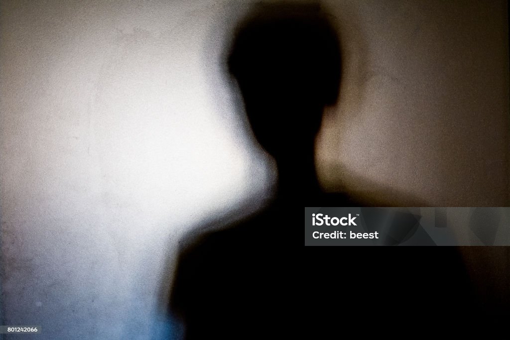 person shadows with Frosted glass - violations concept person shadows with Frosted glass - violations concept background Shadow Stock Photo