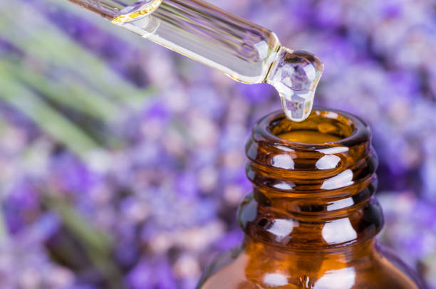 Lavender oil.Essential oil, natural face and body beauty remedies. Lavender oil bottle and pipette.Essential oil, natural face and body beauty remedies. aromatherapy oil photos stock pictures, royalty-free photos & images