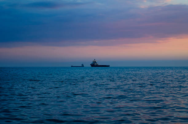 istock Silhouette of the ship over the sunrise 801267716
