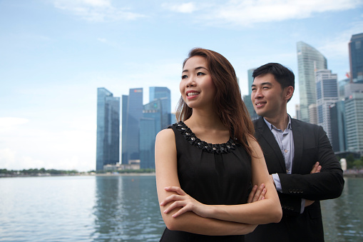 Asian Business Team with Singapore City background