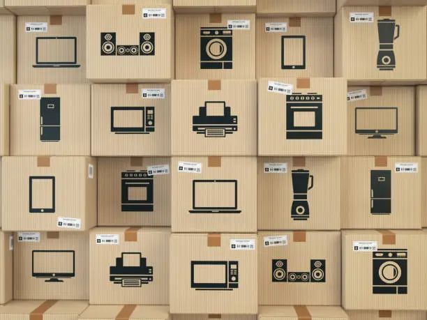 Photo of Household kitchen appliances and home electronics in boxes . E-commerce, internet online shopping and delivery concept.