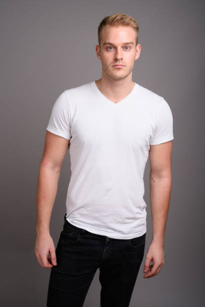 istock Studio shot of young muscular handsome man against gray background 801289964