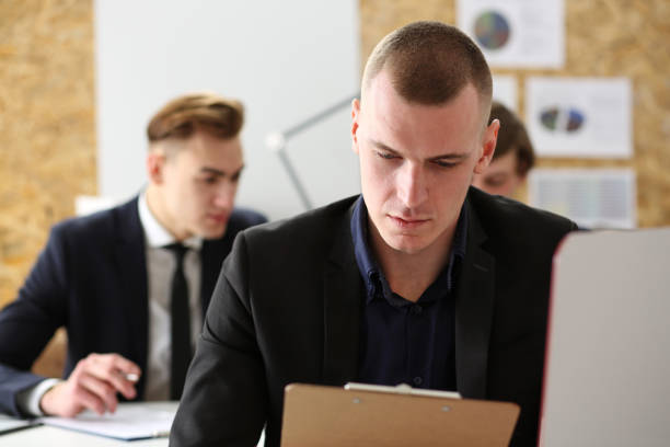 istock Handsome businessman in suit portrait at office workplace 801300032