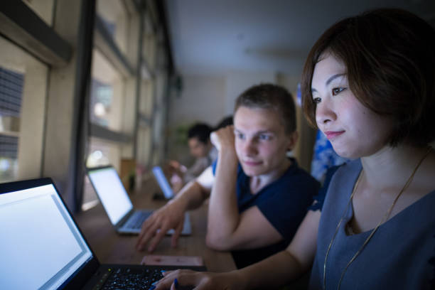 istock Multi-ethnic group of business people doing night work together 801300404