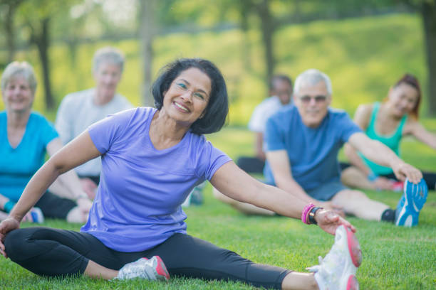 istock Senior Group Exercises in the Park 801309758
